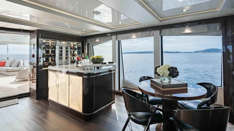  Yacht Photos Pics Luxurious interior of 2016 Sunseeker 131 Yacht with ocean view and elegant dining area.