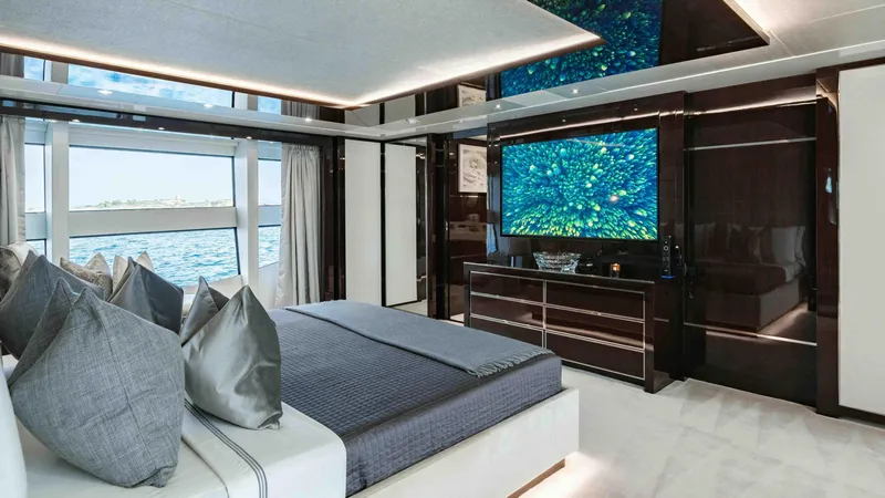  Yacht Photos Pics Luxurious bedroom interior of 2016 Sunseeker 131 Yacht with ocean view.