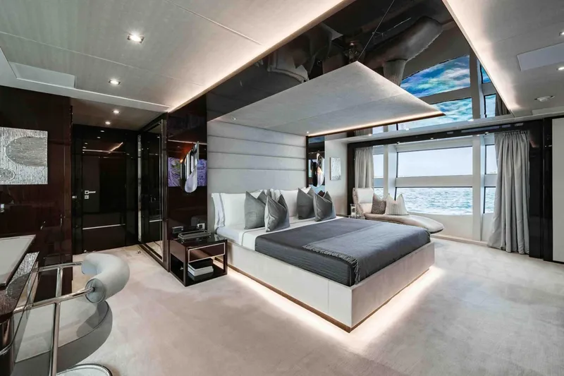  Yacht Photos Pics Luxurious bedroom interior of 2016 Sunseeker 131 Yacht with ocean view.