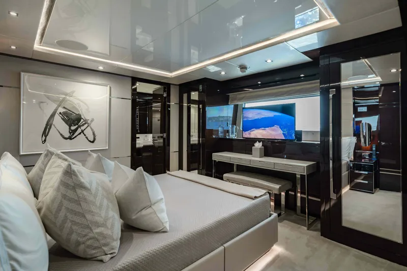  Yacht Photos Pics Luxurious bedroom interior of 2016 Sunseeker 131 Yacht with modern decor and elegant furnishings.