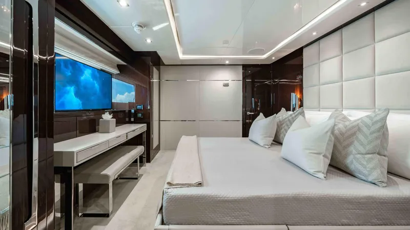  Yacht Photos Pics Luxurious bedroom interior of 2016 Sunseeker 131 Yacht with modern decor and large bed.