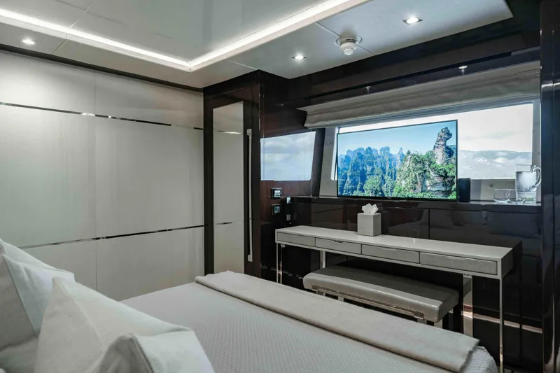  Yacht Photos Pics Luxurious bedroom interior of 2016 Sunseeker 131 Yacht with modern decor and large window.