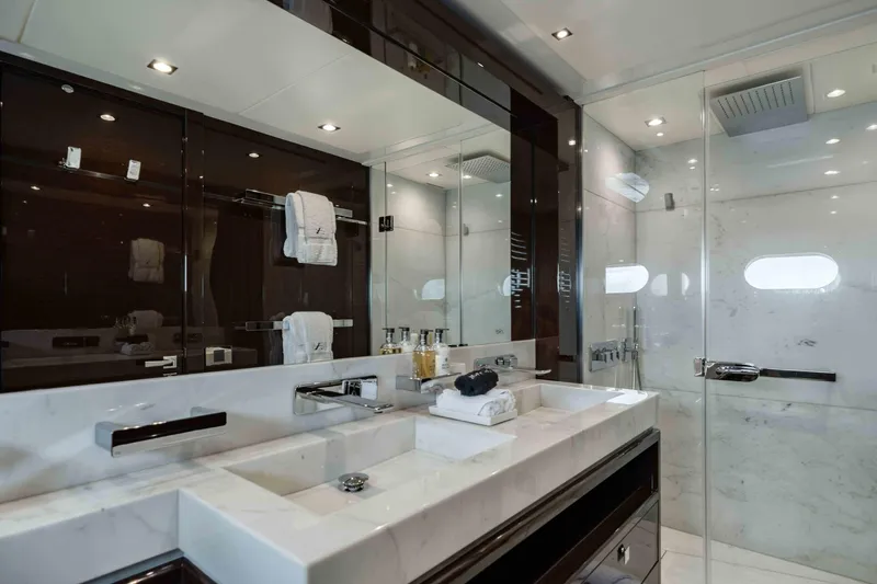  Yacht Photos Pics Luxurious bathroom on 2016 Sunseeker 131 Yacht with marble sink and glass shower.