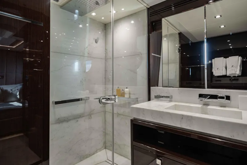  Yacht Photos Pics Luxurious bathroom in 2016 Sunseeker 131 Yacht with marble shower and modern fixtures.