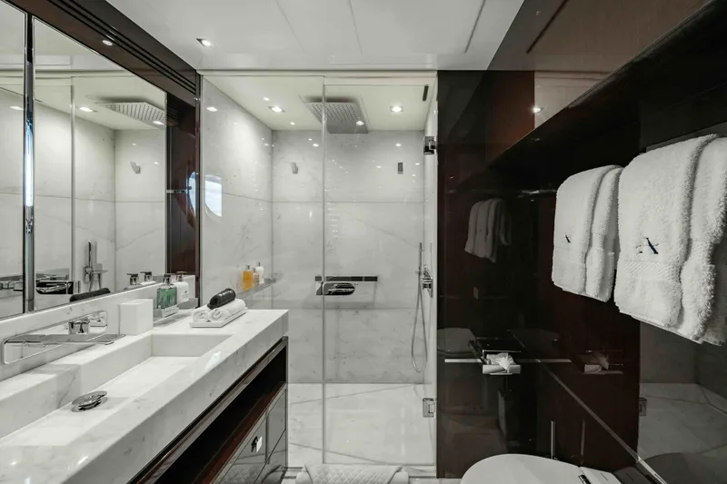  Yacht Photos Pics Luxurious bathroom on 2016 Sunseeker 131 Yacht with marble shower and elegant fixtures.