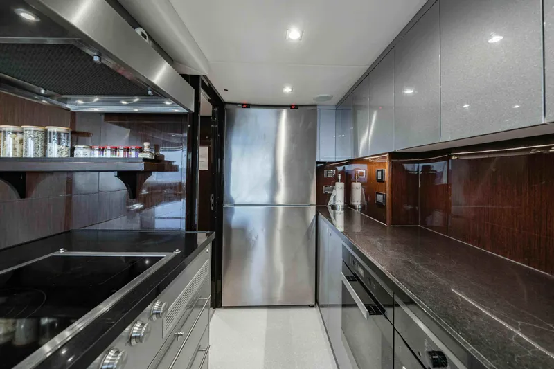  Yacht Photos Pics Modern kitchen interior on 2016 Sunseeker 131 Yacht, featuring sleek appliances and cabinetry.