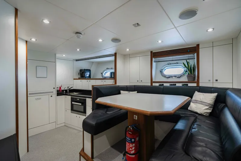 Yacht Photos Pics Luxurious interior of 2016 Sunseeker 131 Yacht with modern kitchen and seating area.