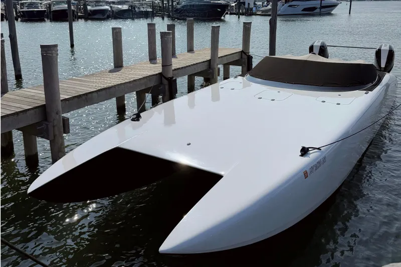  Yacht Photos Pics 2023 Doug Wright 36 docked at marina, sleek white design.