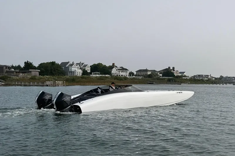  Yacht Photos Pics 2023 Doug Wright 36 boat cruising on water with dual Merc 450 Racing engines.