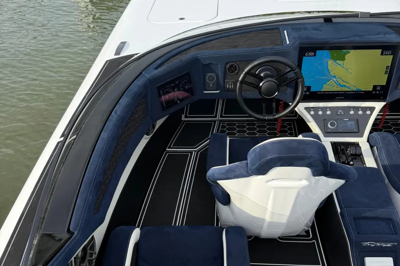  Yacht Photos Pics Luxurious 2023 Doug Wright 36 boat cockpit with advanced navigation system and plush seating.