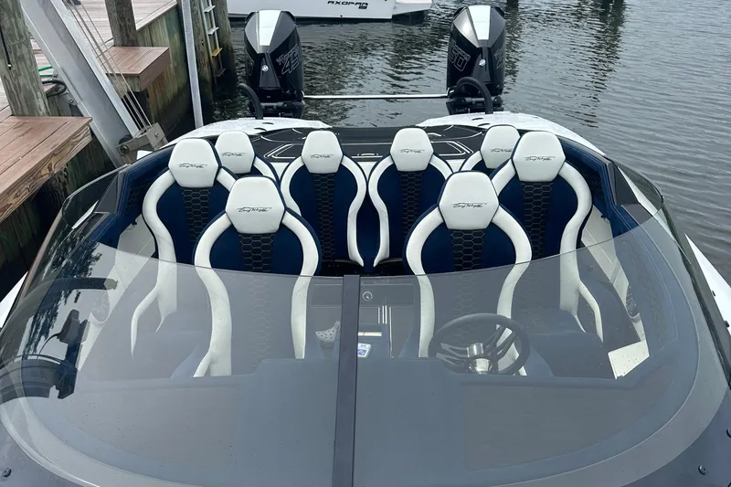  Yacht Photos Pics 2023 Doug Wright 36 boat with sleek seating and dual 450's at the dock.