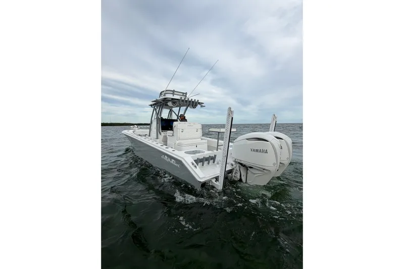  Yacht Photos Pics 2024 SeaHunter 28 Floridian boat cruising on open water with Yamaha engine.