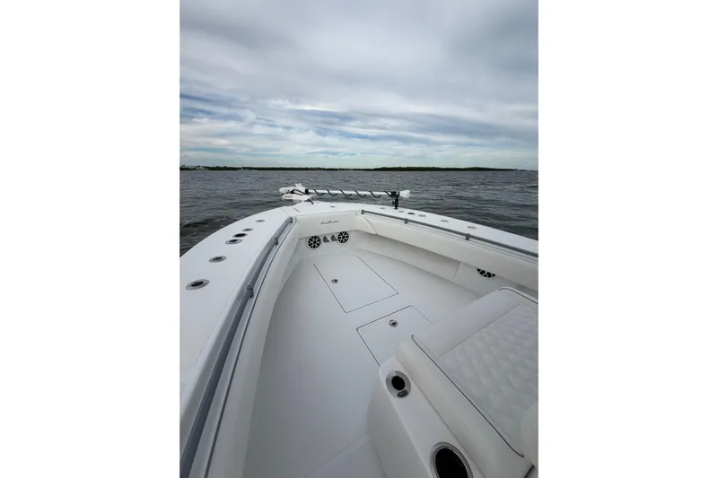  Yacht Photos Pics 2024 SeaHunter 28 Floridian boat on open water under cloudy sky.