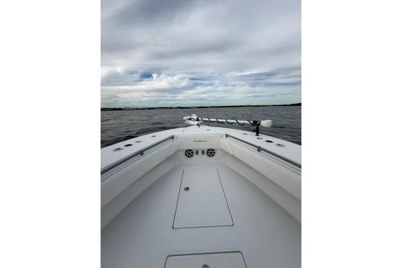  Yacht Photos Pics 2024 SeaHunter 28 Floridian boat on open water under cloudy sky.