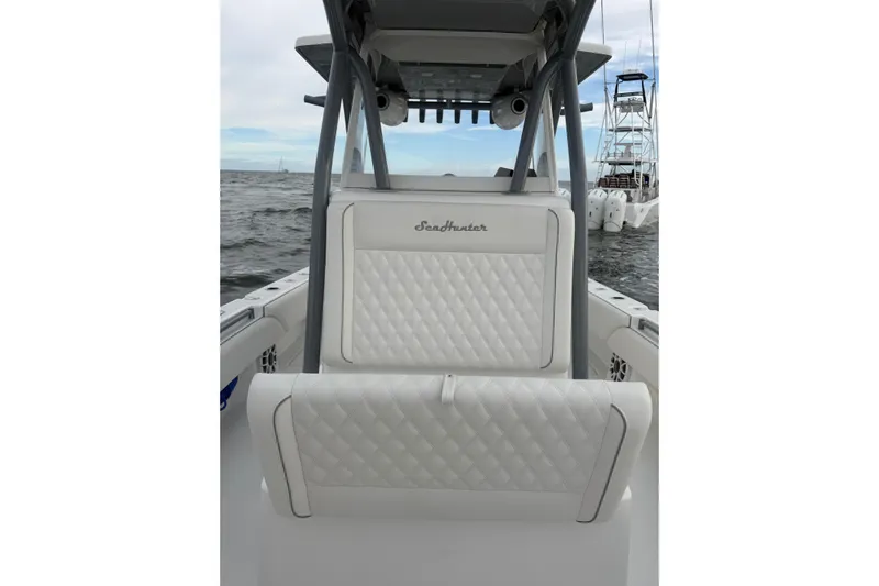  Yacht Photos Pics 2024 SeaHunter 28 Floridian boat interior with white quilted seating on the water.