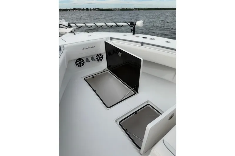  Yacht Photos Pics 2024 SeaHunter 28 Floridian boat deck with open storage compartments.