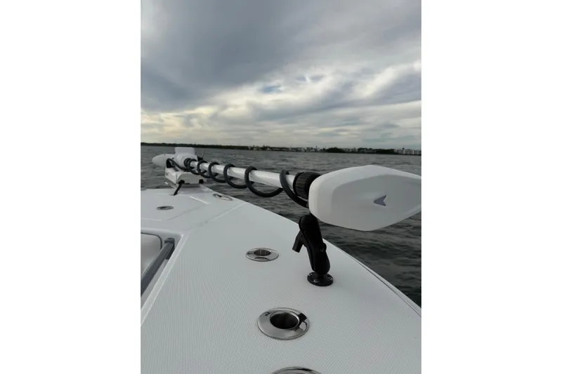  Yacht Photos Pics 2024 SeaHunter 28 Floridian boat on water, featuring sleek deck design and overcast sky.