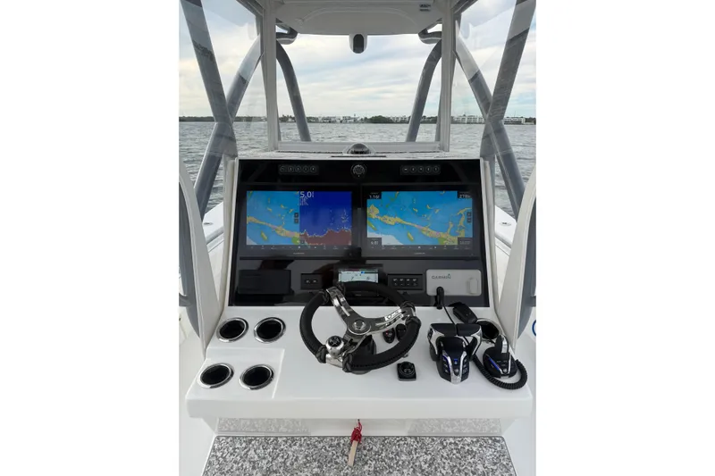  Yacht Photos Pics 2024 SeaHunter 28 Floridian boat dashboard with navigation screens and controls.