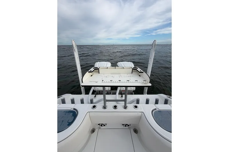  Yacht Photos Pics 2024 SeaHunter 28 Floridian boat with fishing platform on open water.