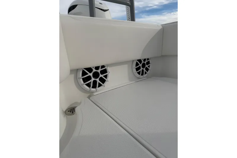  Yacht Photos Pics 2024 SeaHunter 28 Floridian boat interior with speakers and cushioned seating.
