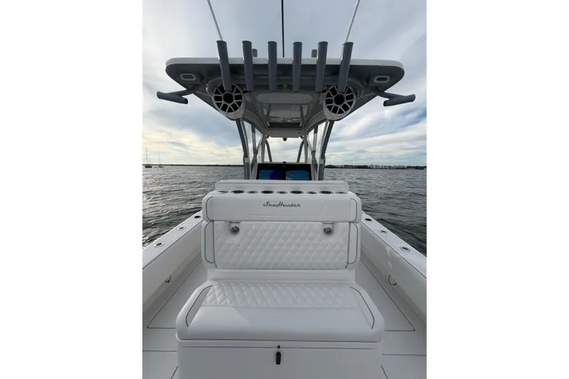  Yacht Photos Pics 2024 SeaHunter 28 Floridian boat interior with seating and rod holders on open water.