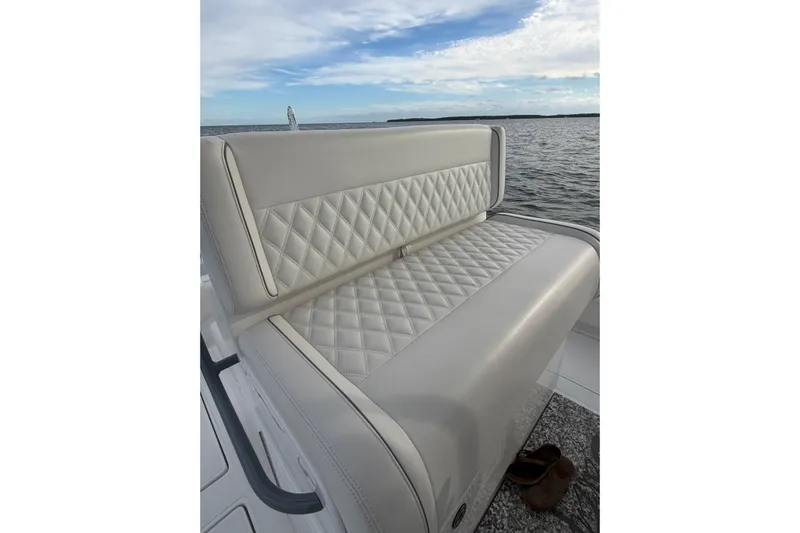  Yacht Photos Pics 2024 SeaHunter 28 Floridian boat with luxurious quilted seating on open water.