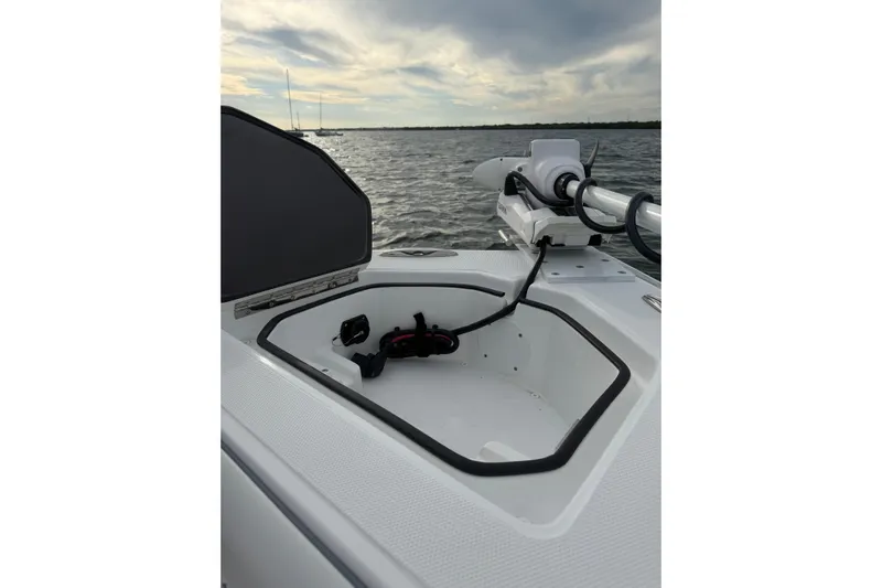  Yacht Photos Pics 2024 SeaHunter 28 Floridian boat with open storage compartment and mounted equipment.
