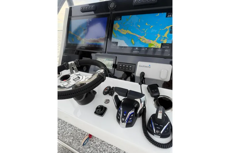  Yacht Photos Pics 2024 SeaHunter 28 Floridian boat dashboard with Garmin navigation displays and controls.