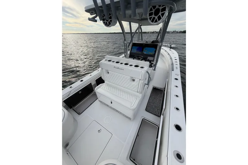  Yacht Photos Pics 2024 SeaHunter 28 Floridian boat interior with seating and navigation equipment on the water.