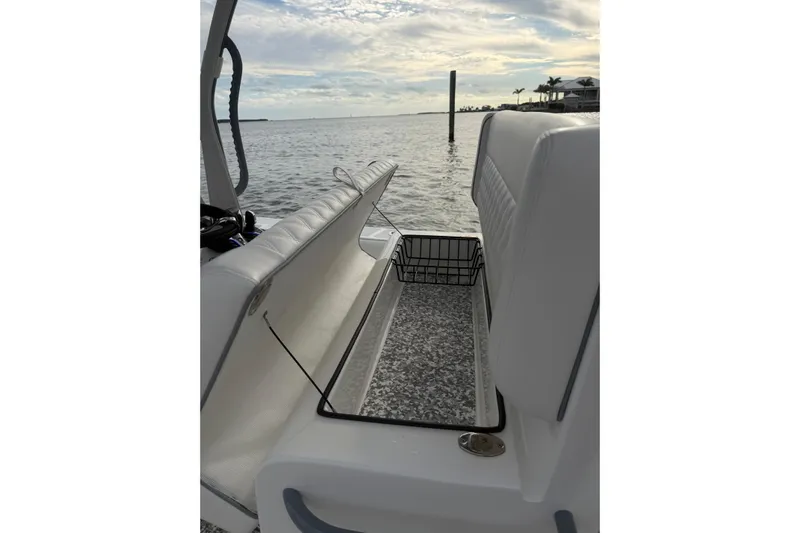  Yacht Photos Pics 2024 SeaHunter 28 Floridian boat interior with open storage compartment, ocean view.