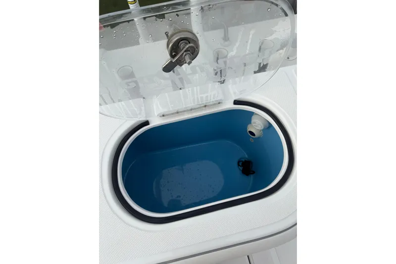  Yacht Photos Pics 2024 SeaHunter 28 Floridian livewell with open lid, showcasing interior design.