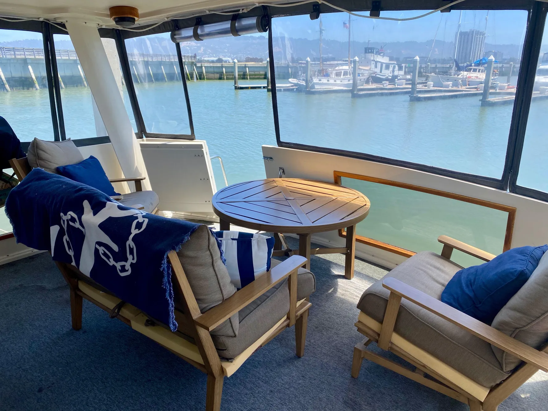 1988 Californian Sundeck Motoryacht interior with cozy seating and marina view.