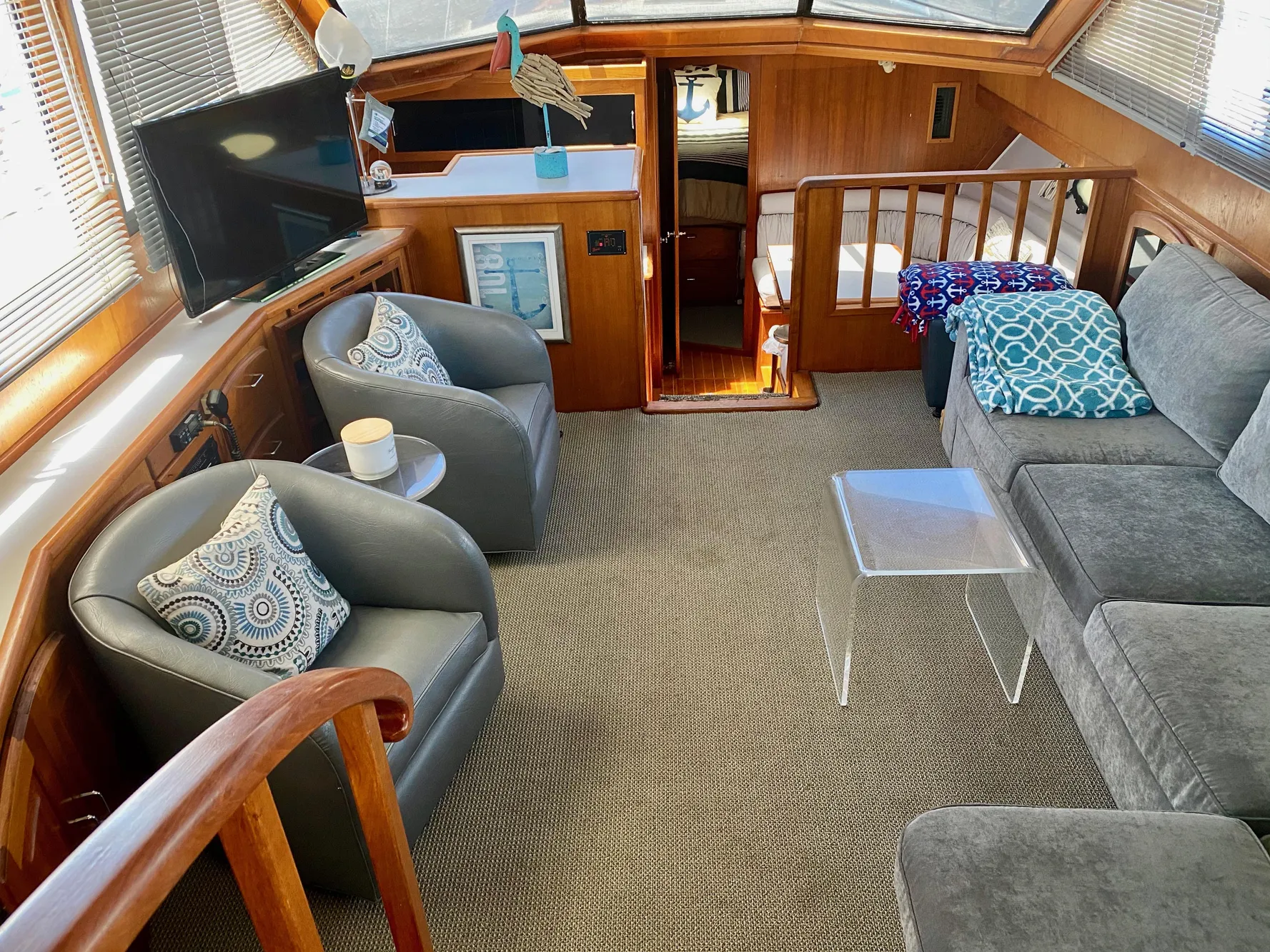 Interior of 1988 Californian Sundeck Motoryacht with cozy seating and modern decor.