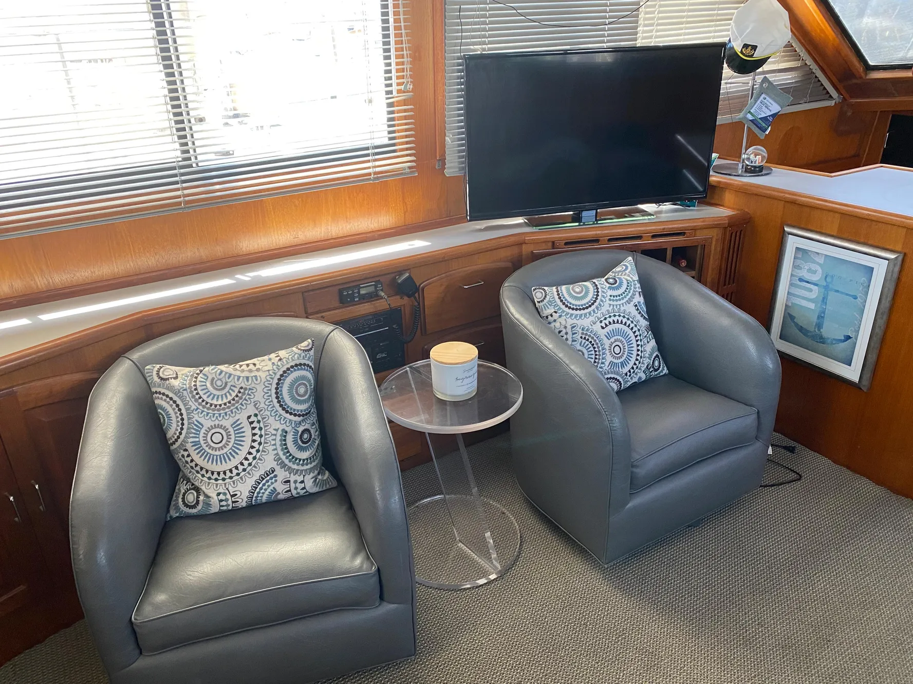 Interior of 1988 Californian Sundeck Motoryacht with modern seating and TV.