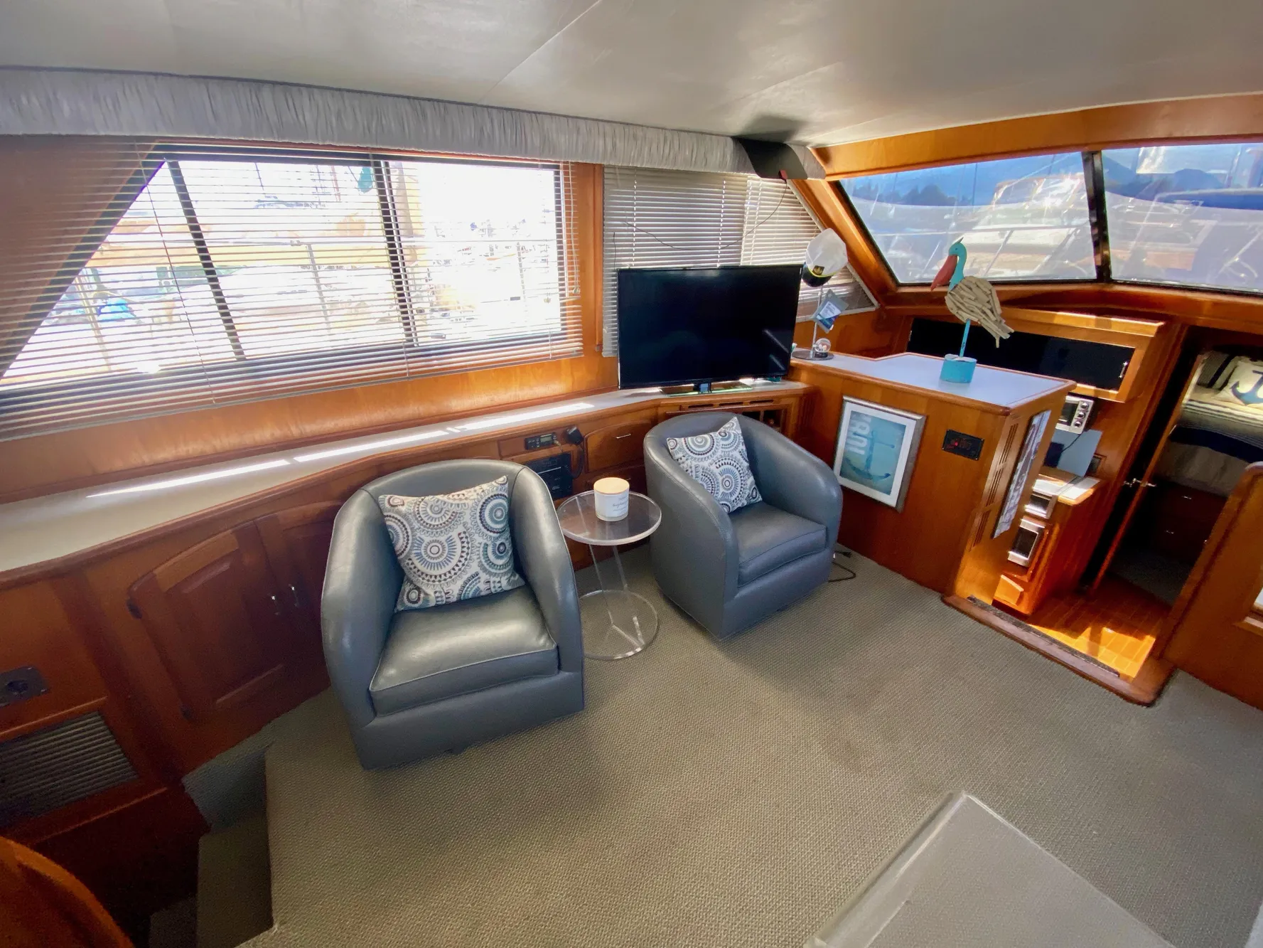 Interior of 1988 Californian Sundeck Motoryacht with cozy seating and modern decor.