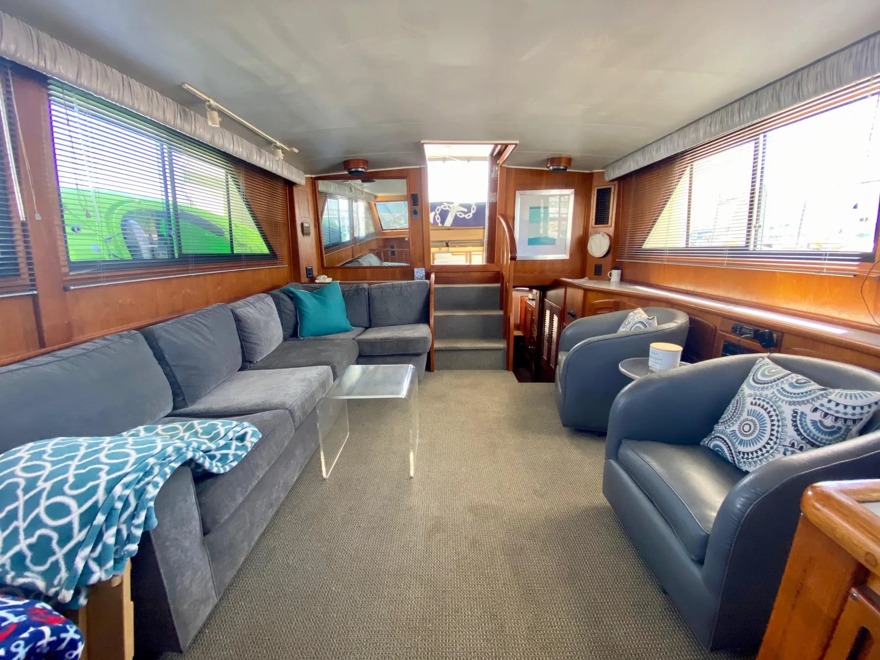 Spacious interior of 1988 Californian Sundeck Motoryacht with comfortable seating and modern decor.