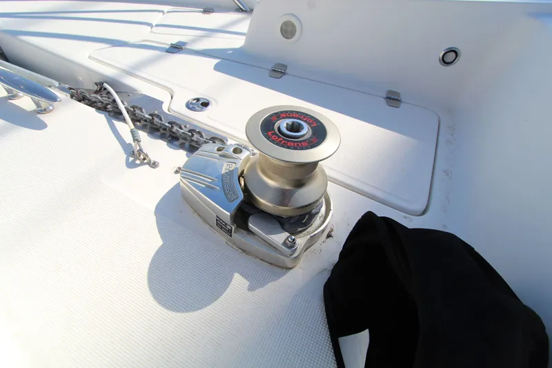  Yacht Photos Pics Anchor winch on 2002 Regal Commodore 4260 yacht deck, featuring chain and cleat.