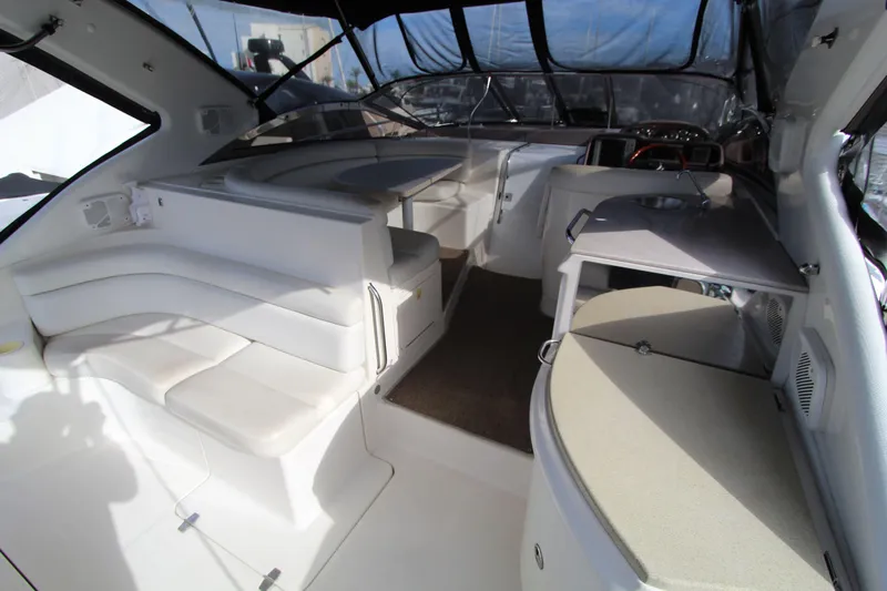  Yacht Photos Pics 2002 Regal Commodore 4260 yacht interior with white seating and modern amenities.