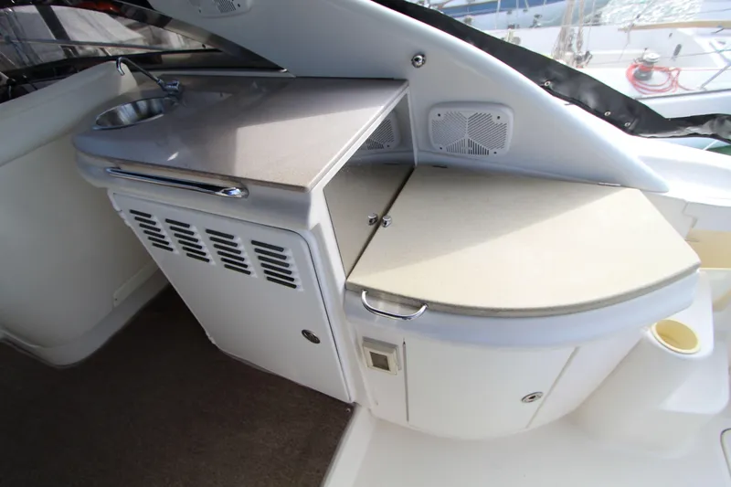  Yacht Photos Pics 2002 Regal Commodore 4260 yacht interior with sink and storage area.