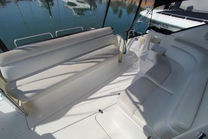  Yacht Photos Pics 2002 Regal Commodore 4260 yacht interior with white seating and water view.