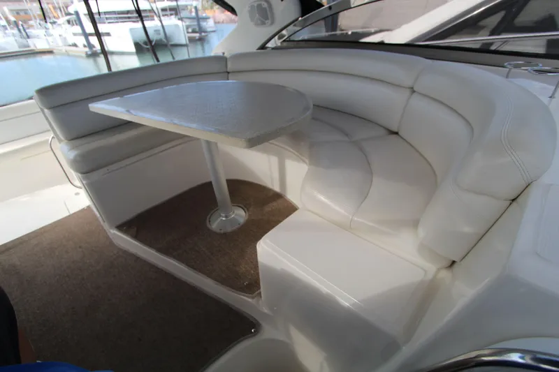  Yacht Photos Pics Luxurious seating area on a 2002 Regal Commodore 4260 yacht with white leather upholstery.