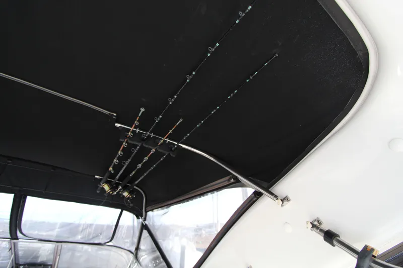  Yacht Photos Pics Ceiling-mounted fishing rods on a 2002 Regal Commodore 4260 boat.