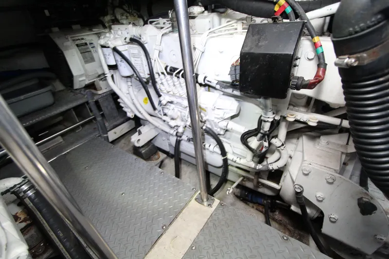  Yacht Photos Pics Engine room of 2002 Regal Commodore 4260 yacht, showcasing mechanical components and wiring.