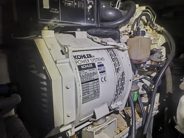  Yacht Photos Pics Kohler power system in 2002 Regal Commodore 4260 engine room, featuring control panel and wiring.