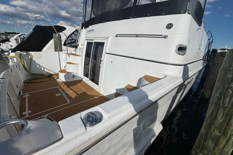 Coral Dreams Yacht Photos Pics 2003 Carver 444 Cockpit Motor Yacht docked, featuring spacious deck and elegant design.