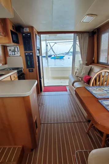 Pathfinder Yacht Photos Pics Interior of 2004 Mainship 400 Trawler with wood flooring and marina view.