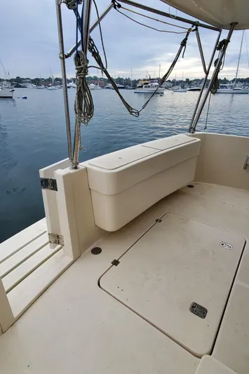 Pathfinder Yacht Photos Pics 2004 Mainship 400 Trawler deck with storage, overlooking a marina.