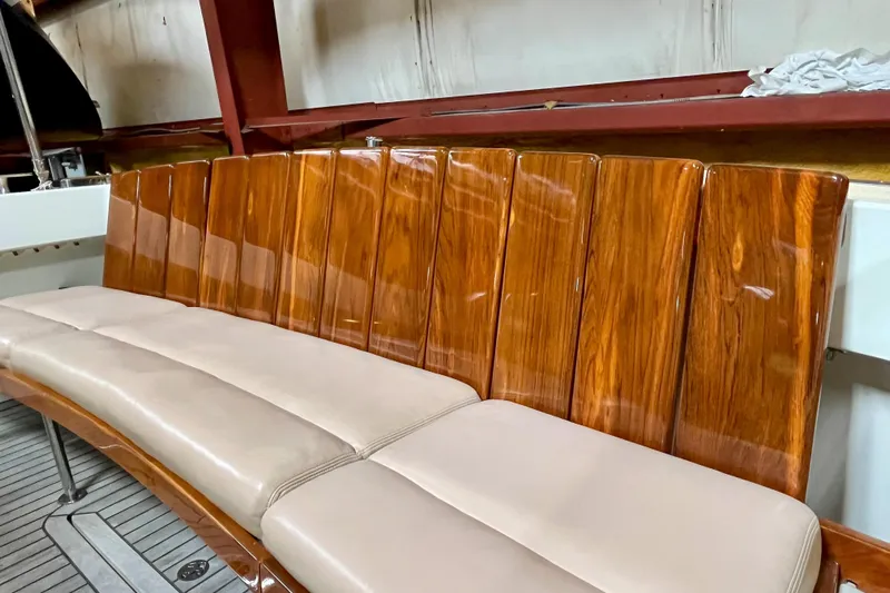  Yacht Photos Pics Luxurious wooden seating on 2009 MJM 34z Downeast boat, featuring elegant beige cushions.