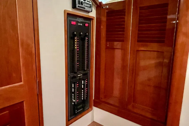  Yacht Photos Pics Electrical panel inside 2009 MJM 34z Downeast boat with wooden cabinetry.