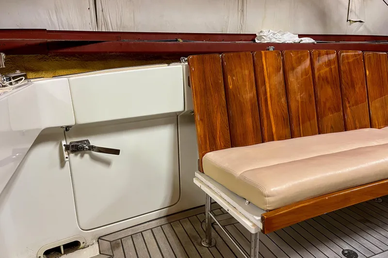  Yacht Photos Pics 2009 MJM 34z Downeast boat interior with wooden seating and white paneling.